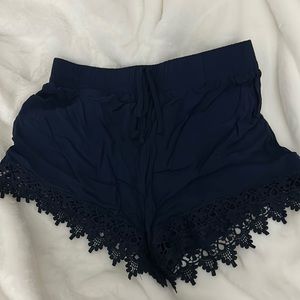 Womens navy shorts. With lace on the bottom.